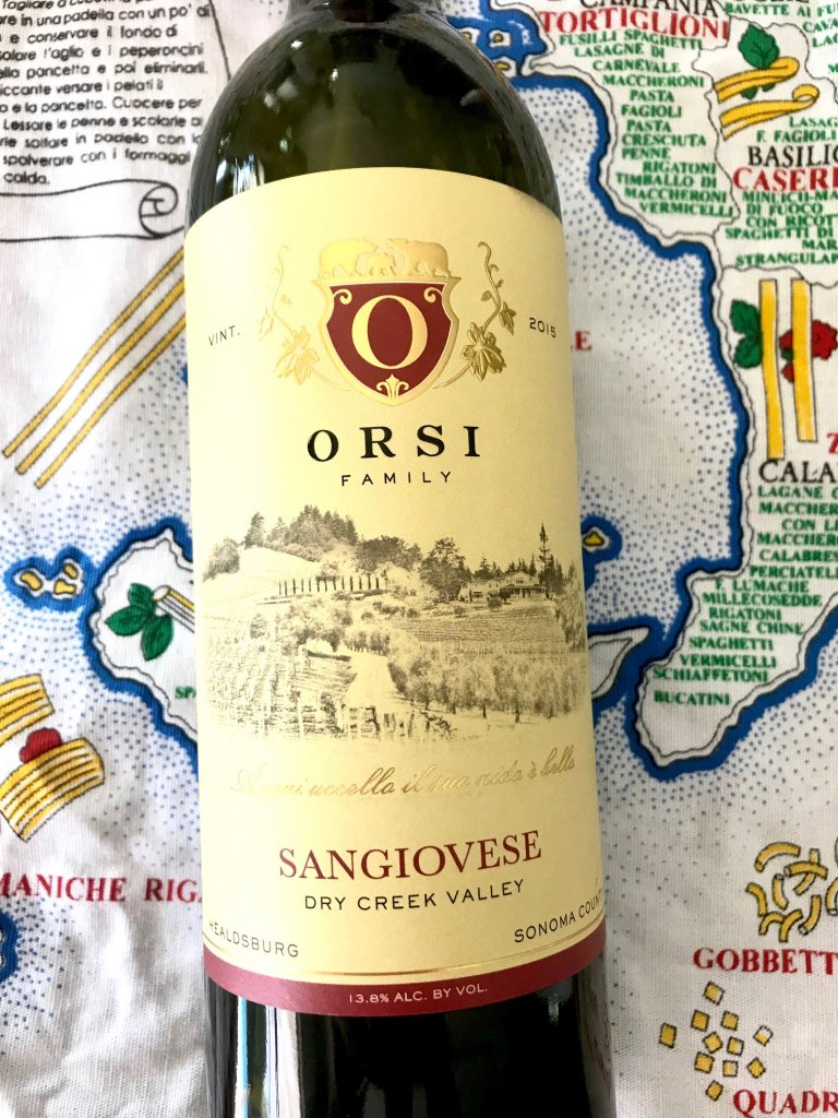 Orsi Family Vineyards bottle of wine. Sangiovese with a classic image in black of a vineyard and family crest in red, with a yellow background